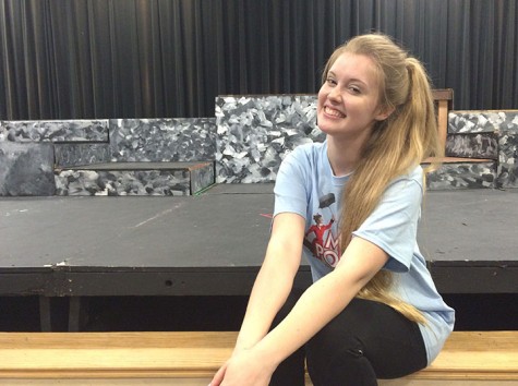 Sophomore Maria Whitmer poses in front of the Black Box theater stage where her beginning acting class takes place. Whitmer said she can’t wait to perform in all sorts of different productions. “I like all of the people you meet,” Whitmer said. “And all of the great experiences you get through acting.” Photo by Marie Biernacki