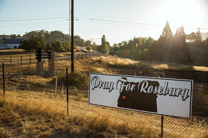 The sign, 'Pray For Roseburg' is placed outside the Umpqua College Road which is blocked off as a crime scene Oct. 2, 2015 in Roseburg, Ore. (Marcus Yam/Los Angeles Times/TNS)