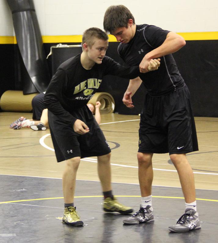 Senior Connor McCarrick wrestles Devin Graff during a practice last year. Graff said the most challenging part of wrestling for him this year will be cutting weight. “I don’t like it, but it’s something we all have to deal with every year.”