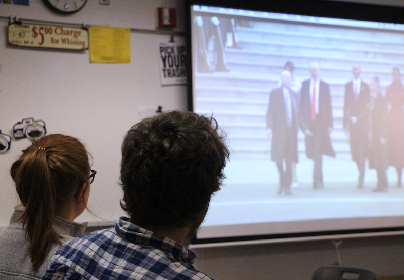 During their lunch break, two BV seniors watch President Donald Trumps Inauguration ceremony on a classroom screen.