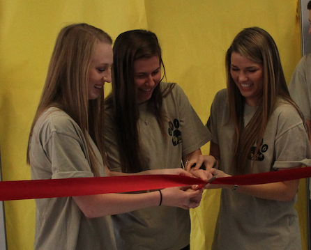 Cutting the ribbon, senior Juliann Phillips stands with her fellow Tigers Inc. staff members. Tigers Inc. is  BV’s school store, and it opened for business on Feb. 23. “We started right at the beginning of the school year planning,” Phillips said. “Everyone got to see what we have been working on for months for the first time, and it was definitely the greatest thing about this experience.” 
