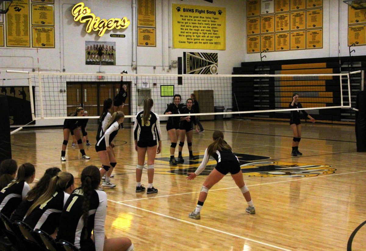 Standing low, sophomore Evelyn Diederich and her other teammates ready themselves for the serve from BV Southwest. Diederich has been on the Varsity volleyball team since freshman year. 