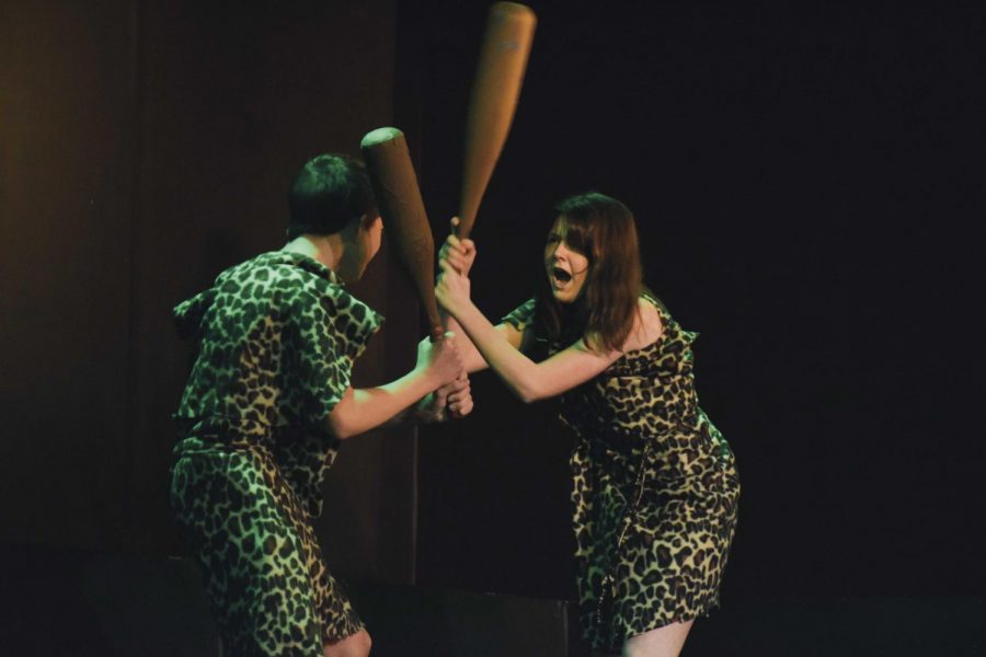 Hitting her castmate with a club, freshman Claire Powell acts as a cave-woman breaking up with her husband. Each act in this play contained a count down to the worst breakup of all time.