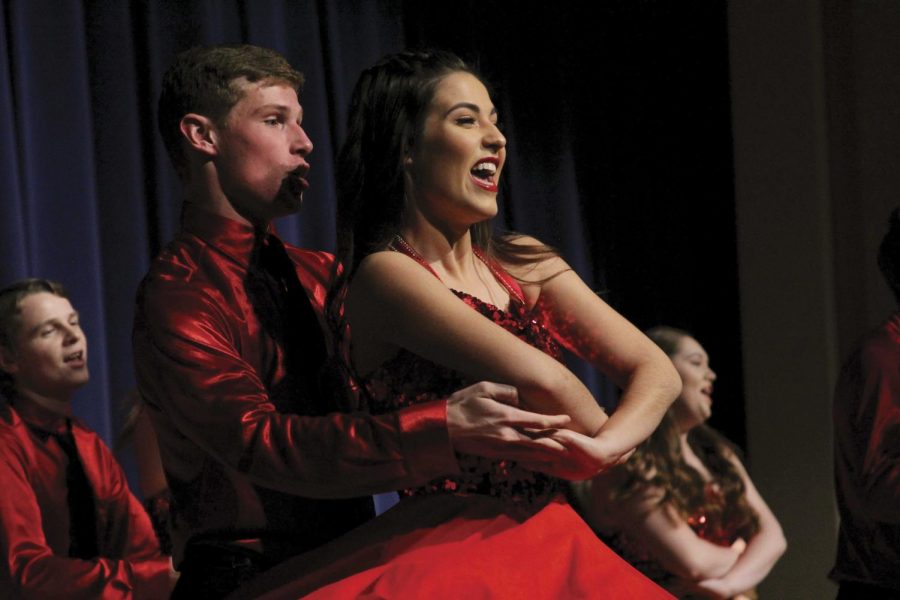 Dancing with her partner, senior Ady Shaw performs with the Chamber Singers. “I love how we include classic choral pieces but also modern pop pieces and pieces from musical theater,” she said.
