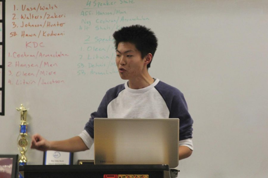 Giving a speech, senior Kevin Man practices for the State debate competition. “[The debate topic this year, which is] education, applies pretty well to the real world,” Man said. “The policies that we talk about actually affect us.”