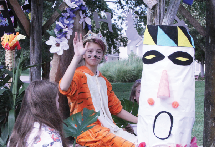 Sitting on the freshman float, Kate O’Byran waves to the crowd. “Ms. Fuller and Ms. Plankers came up with the idea [with me in the tiger costume],” O’Bryan said.